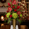 Make a spectacular statement this season with our Tropical Noel Elegance arrangement.