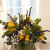 Sunrise Sapphire&rdquo; is a premium floral arrangement featuring a vibrant blend of