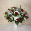 &ldquo;Patriot&rsquo;s Tribute&rdquo; is a stunning red, white, and blue floral arrangement designed