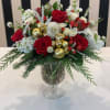 This Stunning arrangement includes a variety of red and white premium blooms