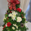 This traditional tree is designed with Boxwood, white roses, red carnations, red