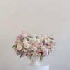 A lush and romantic arrangement featuring a mix of soft pink and