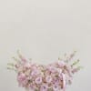 A soft and elegant arrangement featuring a lush blend of pink and