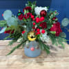 Spreading Christmas cheer is made easy with this arrangement!
Complete with red berries