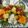 Hydrangea, roses, daisies, button poms, stock and solidago in a long and