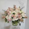 roses, hydrangea, spray roses, ranunculus and stock in muted colors  