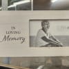 White wash wood picture frame. 
Saying "In loving memory"