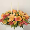 Candle centerpiece with a blend of beautiful oranges,  yellow, red, brown