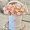 A timeless arrangement featuring 30-35 fresh pink and white roses complemented by