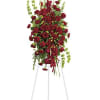 At FloristMarketplace, this elegant all-red funeral spray conveys compassion and deep devotion.