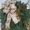 These handmade wreaths feature an assortment of pine, fir, berried juniper and