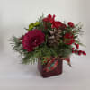 Accentuate the Christmas spirit with this cozy bouquet of red and green