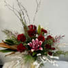 A stunning design, with roses, lilies and lots of holiday joy