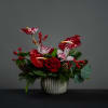 Lovely metal fluted bowl filled with exotic anthurium, roses, and cymbidium orchids