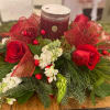 This beautiful centerpiece is sure to brighten anyones home this Holiday season!