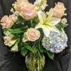 Breathtaking! Blooms of bright white and light pink accented with blue hydrangea