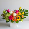Send a sweet escape with our Tropical Chic arrangement, a mid-sized, upscale