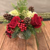 This beautiful floral design features beautiful red roses, mini green hydrangeas, Christmas
