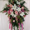 Standing spray on an easel made with pink and white flowers 