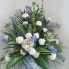 White and blue flowers with tropical greenery