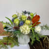 This crisp white and green arrangement comes in ceramic vessel with graceful