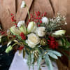 Classic white and red holiday arrangement with hints of gold baubles and