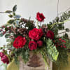 This arrangement is sure to bring seasonal holiday cheer to you or