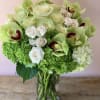 Green Cymbidium orchids, white roses, white spray roses with green  and