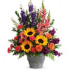 A colorful reminder that brighter days are ahead, this uplifting arrangement of
