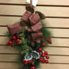 Christmas Hanging silk arrangement with red berries, pine cones, red balls, and