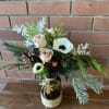 Lovely winter selection of mixed evergreens, gorgeous cappuccino roses anemones pine cones