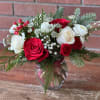 Bubble bowl filled with beautiful evergreens, red and white roses , touches