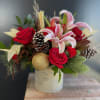 This &quot;Yuletide Elegance&quot; arrangement is a harmonious blend of rich reds and