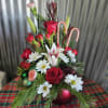 A large Red Ornament with beautiful seasonal christmas flowers 