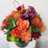 Rich, elegant, and full of vibrant color, this stunning arrangement features a