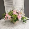 Arrangement include Hydrangea, Roses, Carnations, Lilies, Buttons and Filler