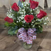  Six of our stunning red roses accented with Baby&#039;s Breath and