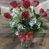 One Dozen Long stem red roses. Accented with beautiful greens, baby&#039;s breath