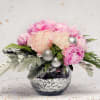 Embrace the power of pink in this lovely holiday arrangement. Up to