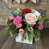 Beautiful twist on Christmas colors with this pink, red and white arrangement