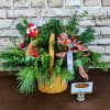 A charming holiday arrangement featuring a mix of lush, fragrant evergreens in