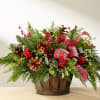 Beautiful  basket arrangement filled with  assorted  premium Christmas greenery