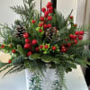 Premium Christmas greenery with pinecones, red berries in a ceramic woodland container