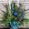 An exotic-inspired evergreen porch pot featuring a striking blend of blues and