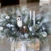 Bring the magic of winter indoors with this enchanting holiday arrangement from
