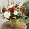 This elegant arrangement consists of red roses, pink hypericum, white ranunculus, white