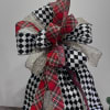 Whimsical mix of harlequin and plaid bow with gold accents in this