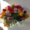 Colorful mixed colors roses in a vase with Alstroemeria, baby&#039;s breath and