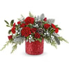 Magical Wish Bouquet is bursting with red flowers and winter greens in