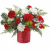 Teleflora&#039;s Christmas Magic Bouquet sparkles with red and green blooms, festive evergreens